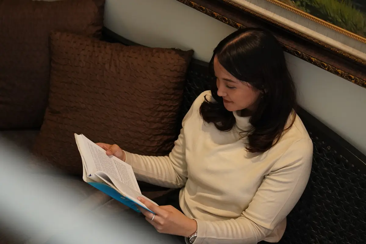 Person reading in comfortable setting